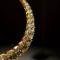 Gold and diamonds at the collarbone: length, clasp, and care